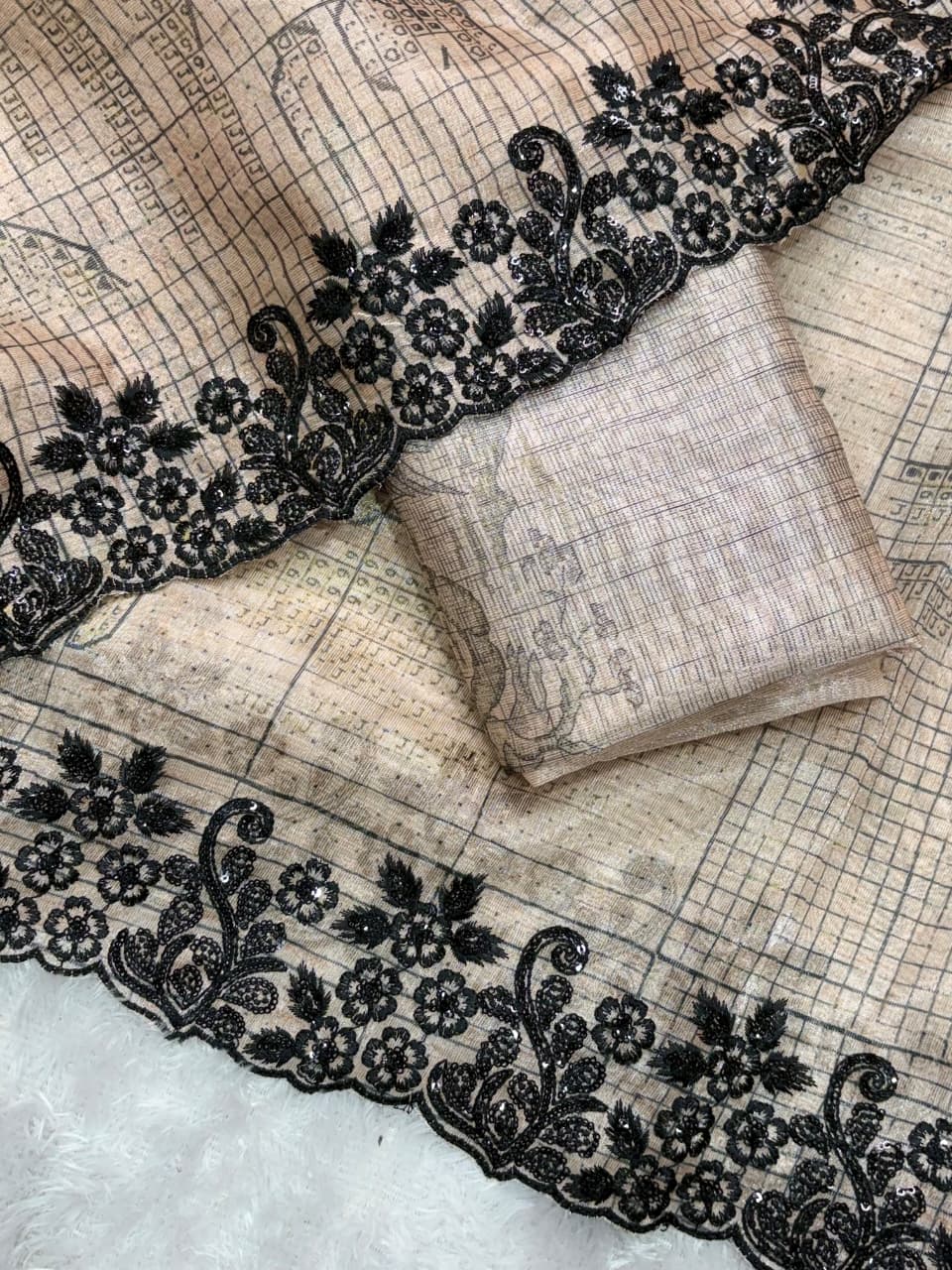 Digital print, Black sequins, Embroidered work creates a tapestry of elegance, This piece of Glass organza saree